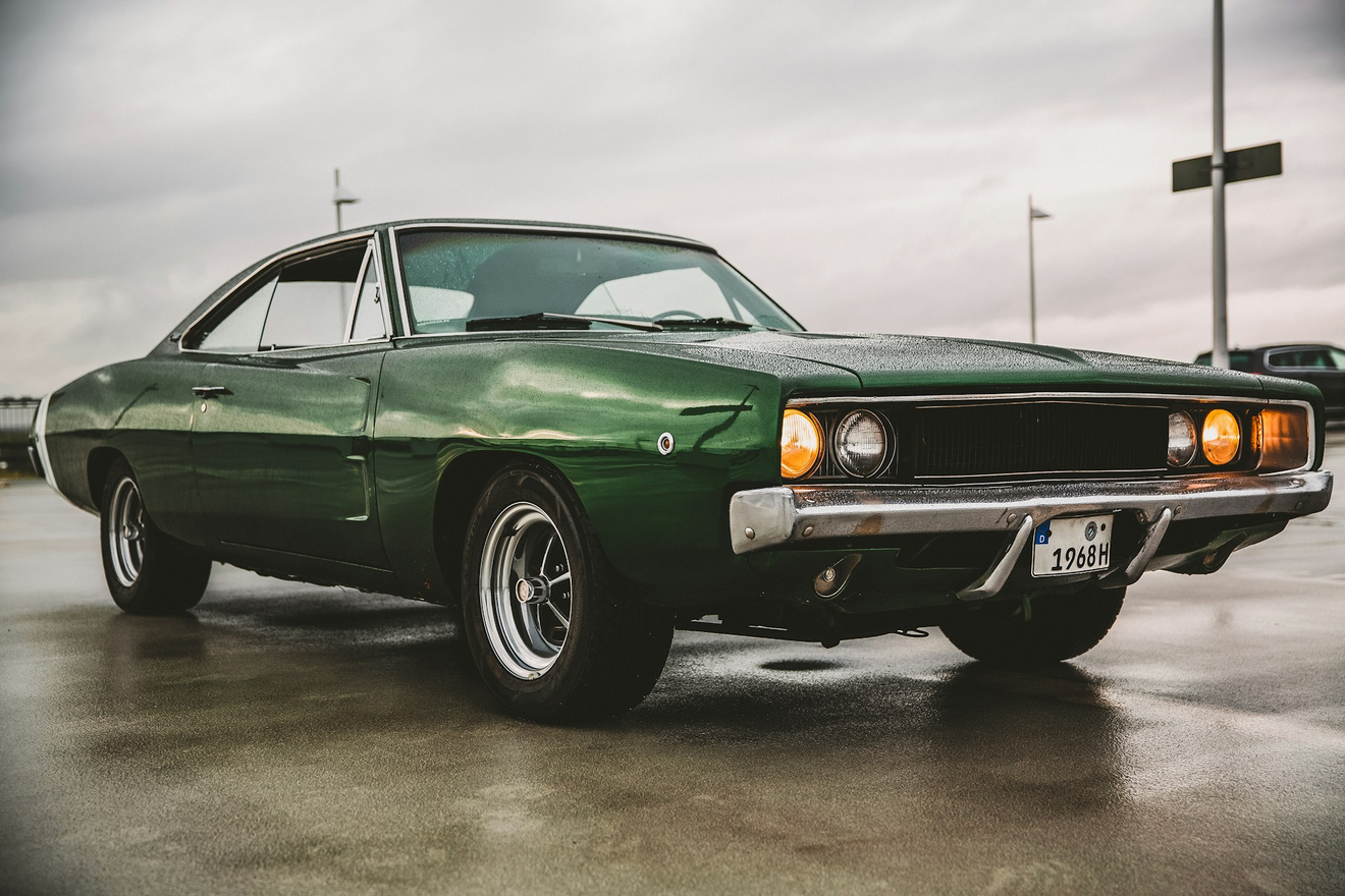 The Power and Prestige of the Dodge Charger: An American Muscle Icon. This image represents: Car, Coupe, Sports Car, Transportation, Vehicle, Tire, Machine, Wheel, Bumper